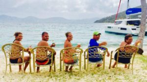 a family of five having fun at the beach