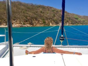 Smile Maker Charters client Joni sitting on a yacht